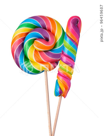Two colorful lollipop swirl spiral big candies on wooden stick rainbow colored isolated on white Two colorful lollipop swirl spiral big candies on wooden stick rainbow colored isolated on white 96459687