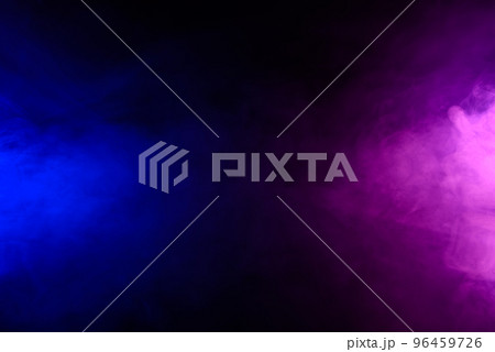 Smoke in blue and purple neon light swirling on black table background with reflection Smoke in blue and purple neon light swirling on black table background with reflection 96459726