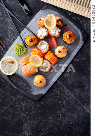sushi roll set served at grey tray at black table. flat lay. close up 96460932