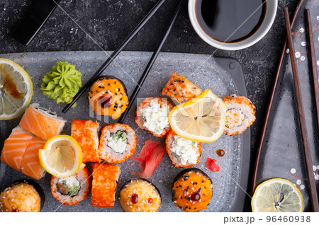 sushi roll set served at grey tray at black table. flat lay. 96460938