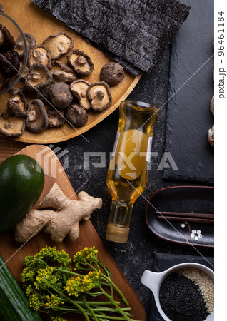 sushi roll set with shiitake mushrooms  served  at gblack dish at black table. flat lay 96461184