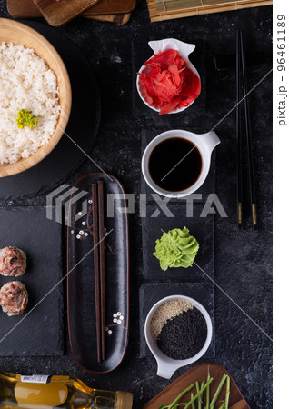 set for sushi served at black dish at black table. flat lay set for sushi served at black dish at black table. flat lay 96461189