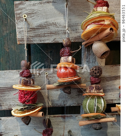 Christmas decoration made of fragrant dried strung fruits. Christmas decoration made of fragrant dried strung fruits. 96463551