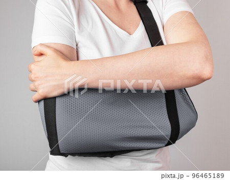 Wearing sling for injured arm, hand, shoulder Wearing sling for injured arm, hand, shoulder 96465189