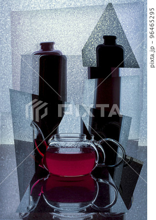 Abstract collage with a glass teapot with red liquid Abstract collage with a glass teapot with red liquid 96465295