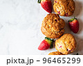 Strawberry muffins on a white marble background. Top view and copy space. 96465299