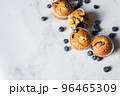 Blueberry muffins on a white marble background. 96465309