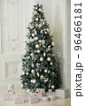 Christmas tree with presents underneath in living room 96466181