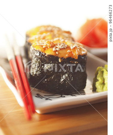 hot sushi with roe and chopsticks hot sushi with roe and chopsticks 96466273