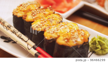 hot sushi roll with salmon . close up hot sushi roll with salmon . close up 96466299