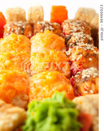 baked sushi rolls with orange and red roe closeup baked sushi rolls with orange and red roe closeup 96466923