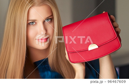 Fashion and accessories, happy beautiful woman holding small red handbag with golden details as stylish accessory and luxury shopping concept Fashion and accessories, happy beautiful woman holding small red handbag with golden details as stylish accessory and luxury shopping concept 96467609