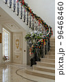 Christmas decorations in the hall of luxurious home with marble stairs and floor 96468460