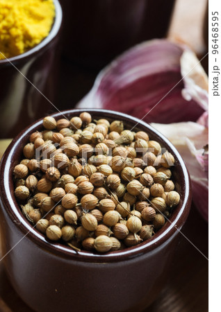 Spices and herbs in ceramic bowls. coriander seasoning. Colorful natural additives. Spices and herbs in ceramic bowls. coriander seasoning. Colorful natural additives. 96468595