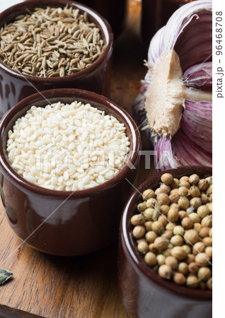 Spices and herbs in ceramic bowls. sesame seasoning. Colorful natural additives. Spices and herbs in ceramic bowls. sesame seasoning. Colorful natural additives. 96468708