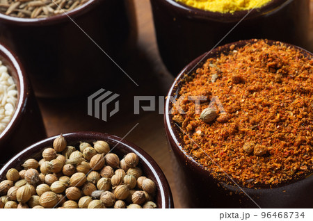 Spices and herbs in ceramic bowls. seasoning. Colorful natural additives. 96468734