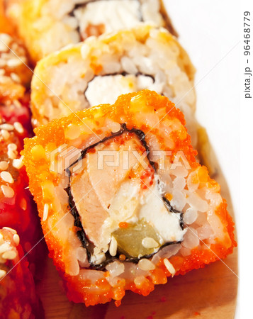 sushi rolls in range on the desk closeup isolated on white sushi rolls in range on the desk closeup isolated on white 96468779