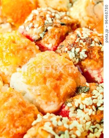 baked sushi rolls with orange and red roe closeup baked sushi rolls with orange and red roe closeup 96468780