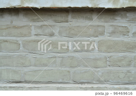 Weathered and stained old brick wall texture Weathered and stained old brick wall texture 96469616