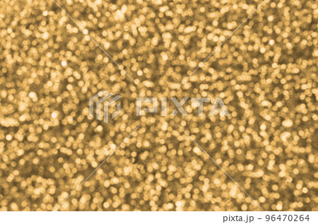 Blurred orange decorative sequins. Background image with shiny bokeh lights from small elements Blurred orange decorative sequins. Background image with shiny bokeh lights from small elements 96470264