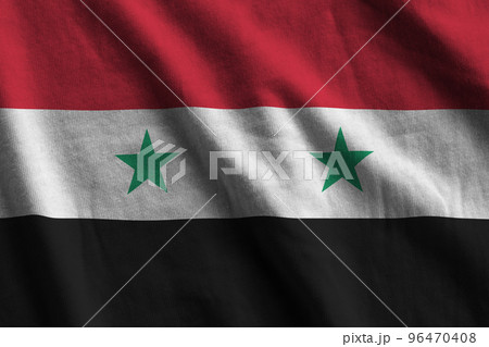 Syria flag with big folds waving close up under the studio light indoors. The official symbols and colors in banner Syria flag with big folds waving close up under the studio light indoors. The official symbols and colors in banner 96470408