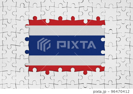 Thailand flag in frame of white puzzle pieces with missing central part Thailand flag in frame of white puzzle pieces with missing central part 96470412