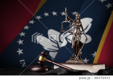 Mississippi new US state flag with statue of lady justice, constitution and judge hammer on black drapery. Concept of judgement and guilt Mississippi new US state flag with statue of lady justice, constitution and judge hammer on black drapery. Concept of judgement and guilt 96470455
