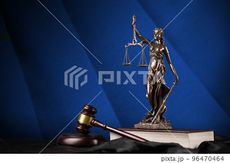 Nevada US state flag with statue of lady justice, constitution and judge hammer on black drapery. Concept of judgement and guilt Nevada US state flag with statue of lady justice, constitution and judge hammer on black drapery. Concept of judgement and guilt 96470464