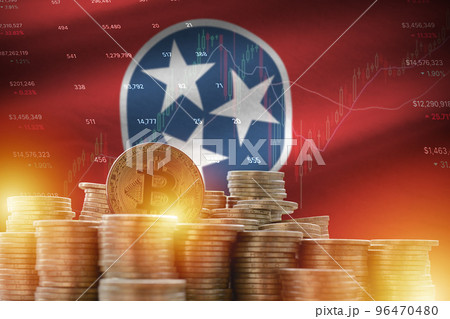 Tennessee US state flag and big amount of golden bitcoin coins and trading platform chart. Crypto currency 96470480