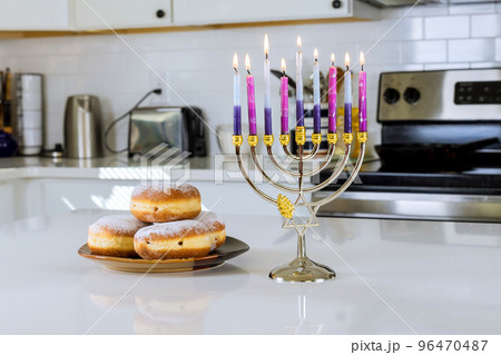 Hanukkah celebration Judaism tradition family religious holiday symbols lighting hanukkiah menorah candles Hanukkah celebration Judaism tradition family religious holiday symbols lighting hanukkiah menorah candles 96470487