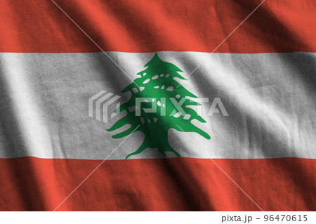 Lebanon flag with big folds waving close up under the studio light indoors. The official symbols and colors in banner Lebanon flag with big folds waving close up under the studio light indoors. The official symbols and colors in banner 96470615