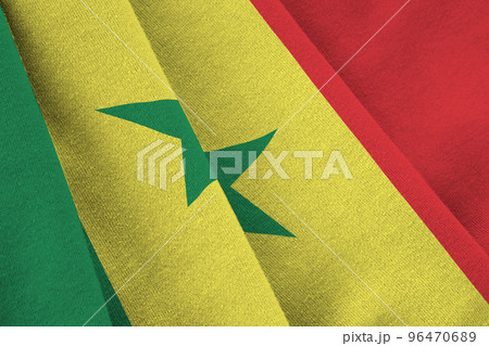 Senegal flag with big folds waving close up under the studio light indoors. The official symbols and colors in banner Senegal flag with big folds waving close up under the studio light indoors. The official symbols and colors in banner 96470689