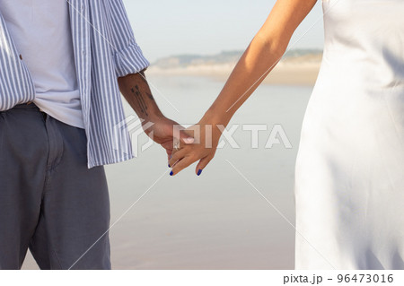 Close-up of happy couple holding hands 96473016