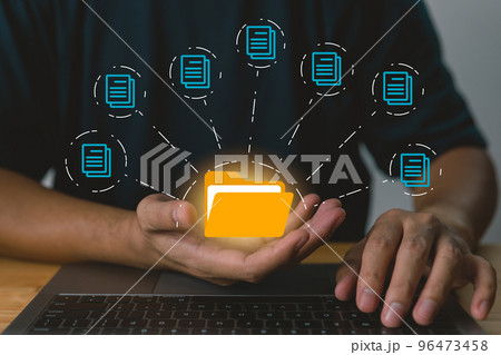 Businessman holding folder and document icon software, searching and managing files in online document databases for efficient archiving and company data. 96473458