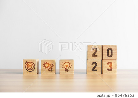 2023 wood block with business goal, plan. Action strategy, target, mission, teamwork, idea and New Year start concept 96476352