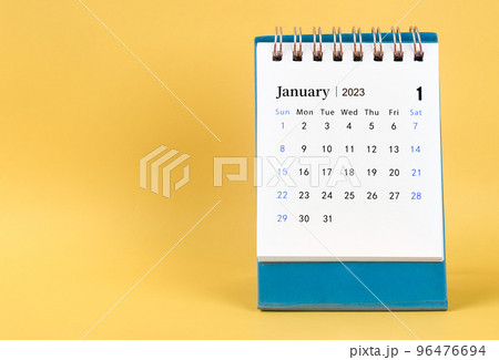 The April 2023 desk calendar on yellow color background. The April 2023 desk calendar on yellow color background. 96476694