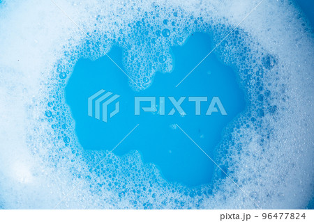 Detergent foam bubble, blue background. Detergent foam bubble, blue background. 96477824