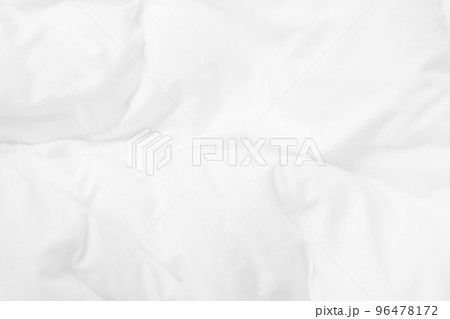 Close up top view of white bedding sheet and wrinkle messy blanket in bedroom after wake up in the morning. Close up top view of white bedding sheet and wrinkle messy blanket in bedroom after wake up in the morning. 96478172