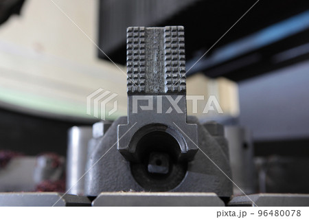 Metal vise in the production of bearings. Metal shavings.Heavy industry. Production of bearings. Metal vise in the production of bearings. Metal shavings.Heavy industry. Production of bearings. 96480078