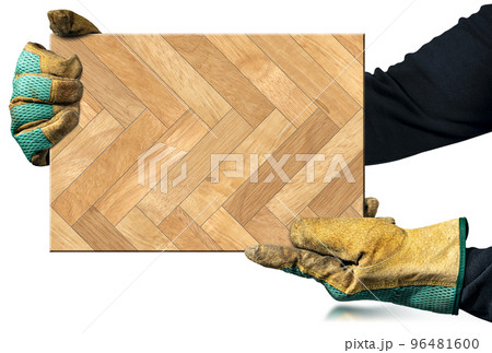 Gloved Hands Holding a Herringbone Wood Parquet Sample Isolated on White 96481600