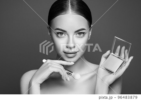 Beauty woman with eye shadow makeup palette 96483879