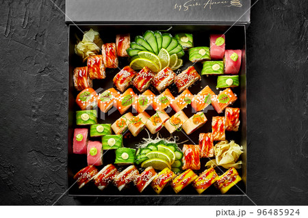 Large set of various Japanese sushi rolls in cardboard box Large set of various Japanese sushi rolls in cardboard box 96485924