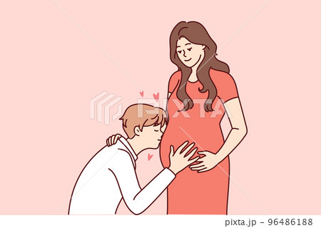 Happy man kiss pregnant woman belly 96486188