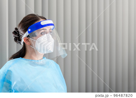 Doctor dressed up in personal protection equipment at hospital 96487820