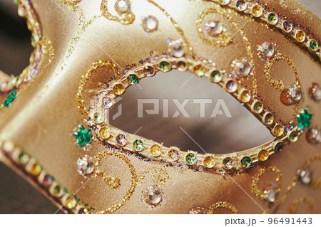 Close up of Festive, colorful Mardi Gras or carnivale mask. Venetian masks. Venetian carnivale celebration concept. Close up of Festive, colorful Mardi Gras or carnivale mask. Venetian masks. Venetian carnivale celebration concept. 96491443
