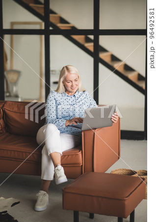 Blonde woman working on the laptop Blonde woman working on the laptop 96492581
