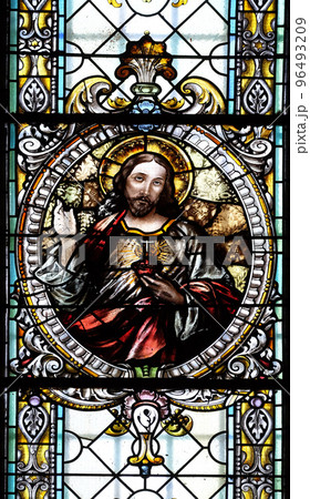 Sacred heart of Jesus, stained glass window in Cathedral of St Nicholas in Novo Mesto, Slovenia 96493209