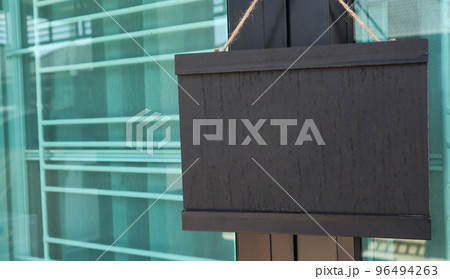 Small black board hanging on the door, copy space                              96494263