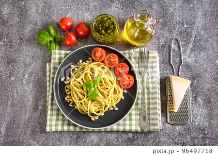 Pasta with fresh homemade pesto sauce and food ingredients 96497718