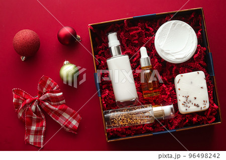 Christmas gift set, xmas holidays beauty box subscription package and luxury skincare products flatlay, cosmetic flat lay on red background, cosmetics as holiday present or shopping delivery, top view Christmas gift set, xmas holidays beauty box subscription package and luxury skincare products flatlay, cosmetic flat lay on red background, cosmetics as holiday present or shopping delivery, top view 96498242